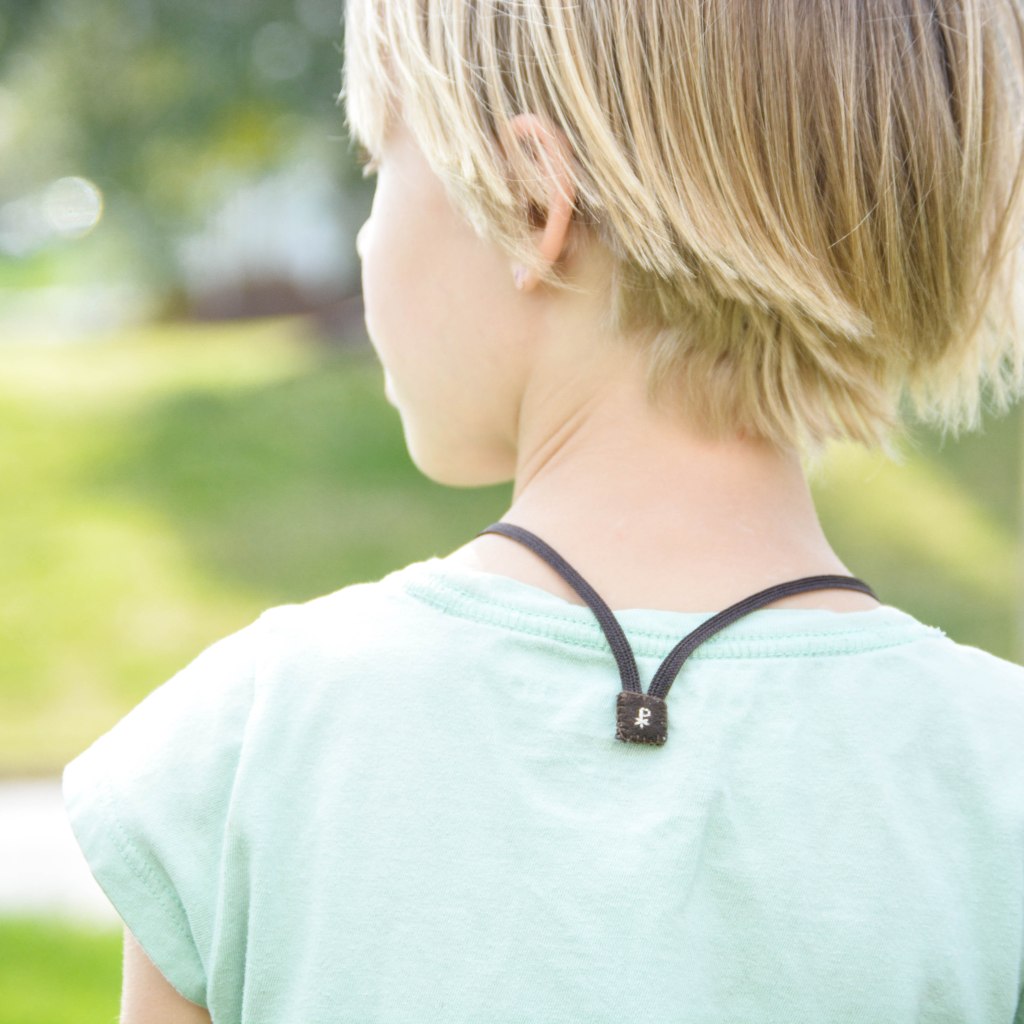 Young Girl Wearing Brown Scapular